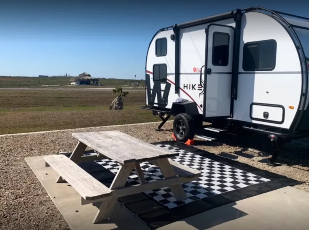 picnic table on rv space next to RV